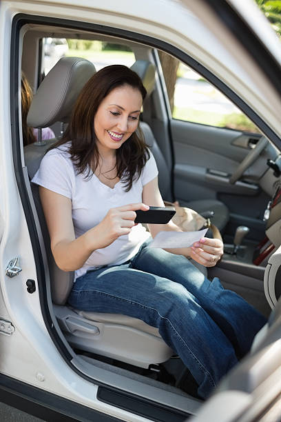 istock Women Using Smart Phone To Deposit Check 167201667