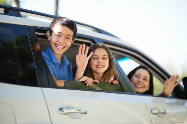 istock Children With Mother Waving From Car Window 167201694