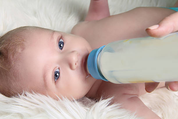 istock Newborn baby drinking milk 167201815