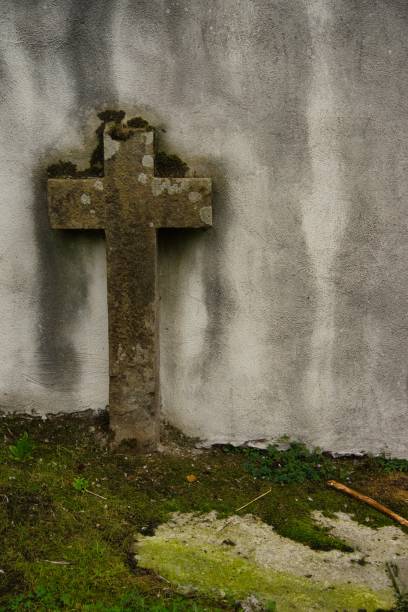 istock Stone cross in an eerie and mysterious atmosphere 1672042164