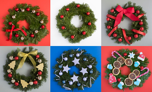Collage of Christmas ring or wreath on the colored background. Top view. Close-up.