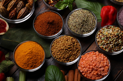 Herbs and Spices with various ground culinary powders