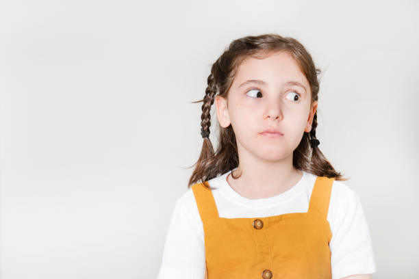 istock Thoughtful little girl looking away thinking 1672074898