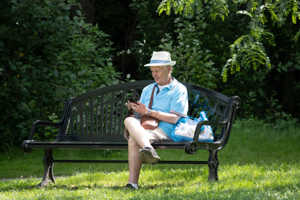 Man sitting on bench stock photo