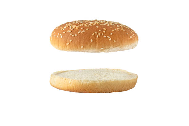 istock Sesame bun for burger top and bottom separated side view isolated on white 1672095420