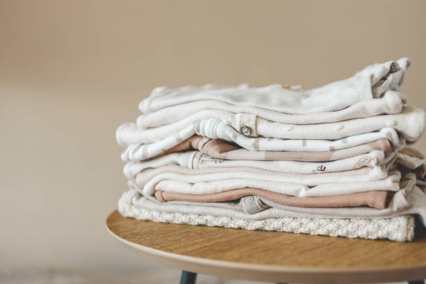 istock Stack of children's things on a wooden pedestal 1672101747