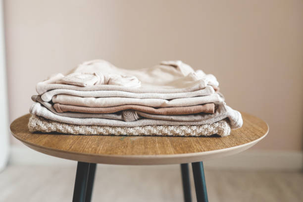 istock Stack of children's things on a wooden pedestal 1672104712
