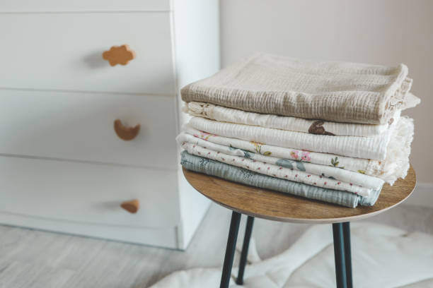 istock Stack of baby muslin blankets and newborn diapers 1672104726
