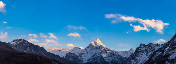 istock Snowy mountain peak illuminated by sunlight idyllic wilderness panorama Himalayas 1672127612