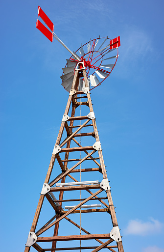 An old windpump against the blue sky.