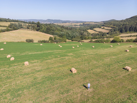 Farmer at his lawn grass agriculture field