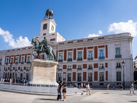 Madrid, Spain - April, 18 2021: Scenic of Plaza Mayor Square in Madrid. View during restrctions for coronavirus covid-19 pandemic. Sunny day with blue sky