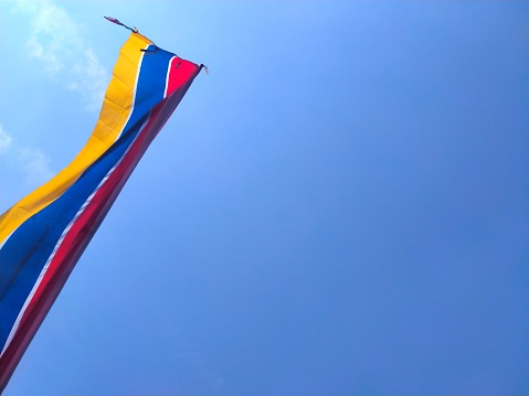 This pennant flag is installed during certain events by the committee