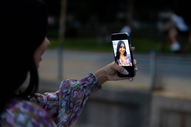 istock Young lady is taking a selfie on mobile phone. 1672196053
