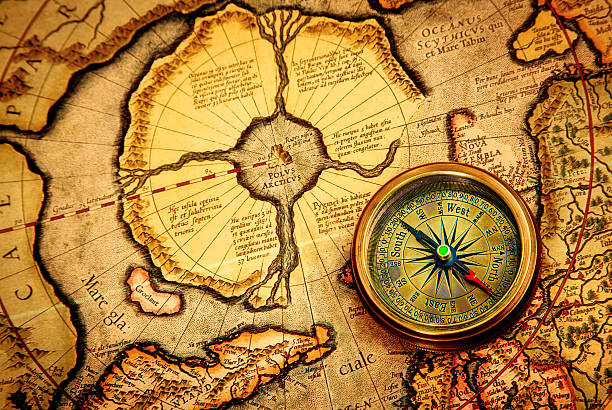 istock compass lies on an ancient map of the North Pole. 167220395
