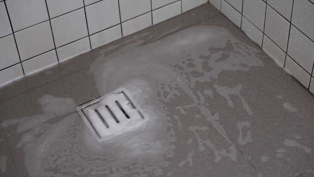 The bathroom drain is clogged and drains slowly.