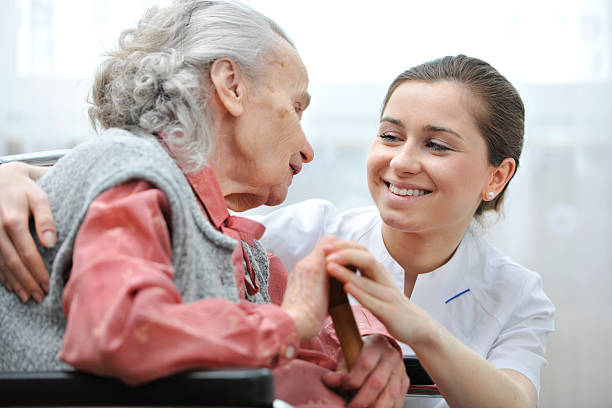 istock An elderly woman and a helper at a nursing home 167222531