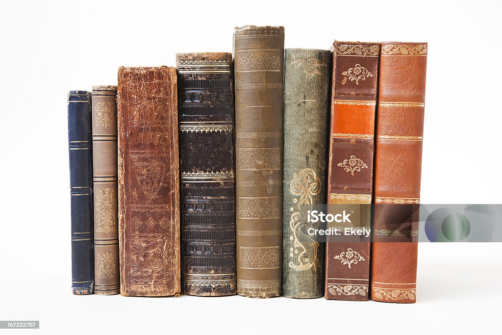 Old books on white background. ld books on white background.  Damages from aging. Book Stock Photo