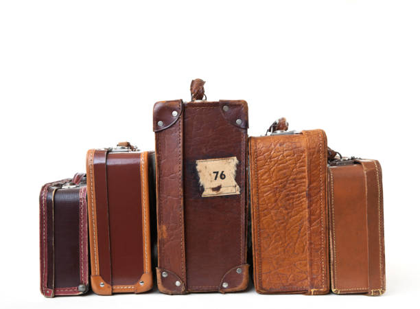 Group of vintage leather suitcases  with labels. Vintage suitcases in a heap. suitcase luggage old fashioned obsolete stock pictures, royalty-free photos & images