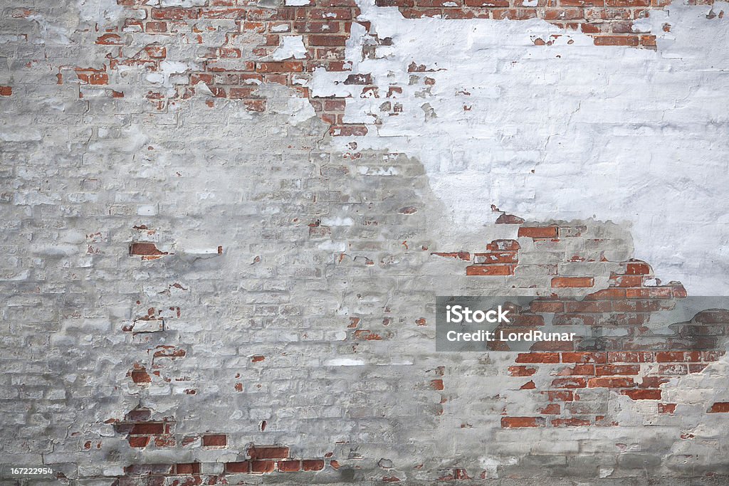 Weathered urban wall Weathered unfinished brick and cement wall. Brick Wall Stock Photo