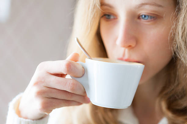 istock Young woman drinking coffee. Cup of hot beverage 167223432
