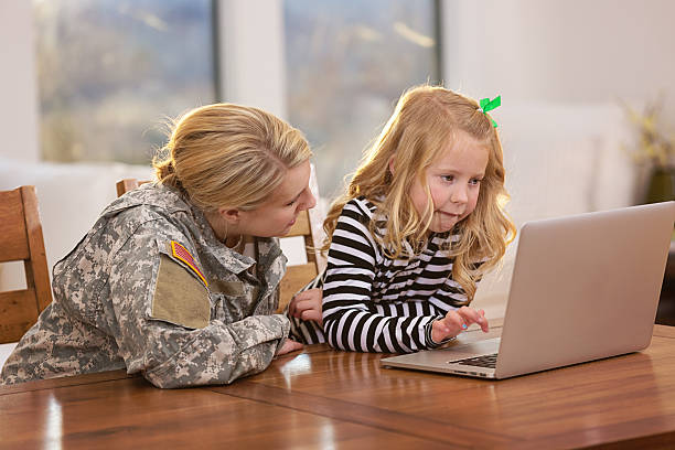 istock Mother and daughter looking at a laptop together 167223559