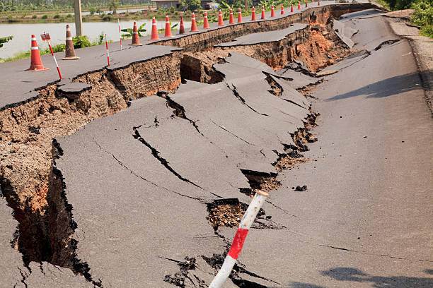 istock Orange cones set alongside a cracked asphalt road 167226413