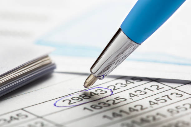 istock Checking the value of securities. Pen, share listing and checking financial chart. Concept of banking, financial report and financial audit. 1672265237