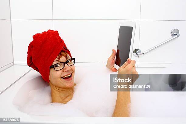 Enthusiastic Woman In Bathtub With Tablet Computers Stock Photo - Download Image Now