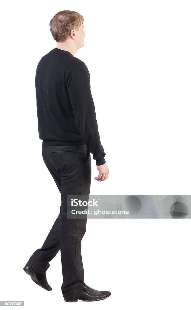 Vista posteriore di Uomo d'affari a piedi - Foto stock royalty-free di Abbigliamento elegante
