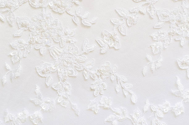 A flower and white lace with pearls