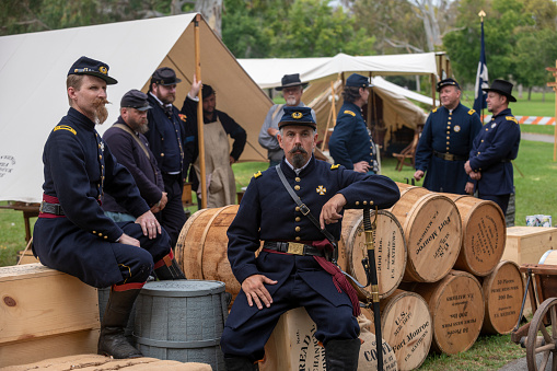 Huntington Beach, CA, USA - September 3, 2023: Union troops resting by supplies  during a  civil war reenactment at the Huntington Beach Historical Society 30th annual Civil War Days Living History Event in Huntington Beach Central Park.
