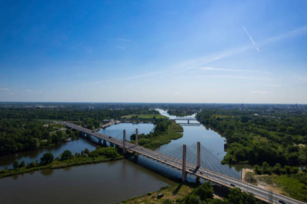 istock suspension bridge over the river (aerial) 1672297465
