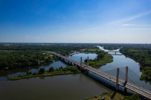 istock suspension bridge over the river (aerial) 1672297467