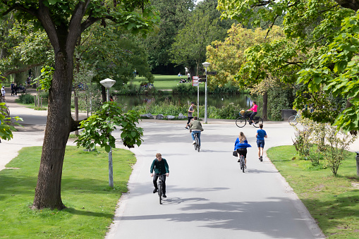 Amsterdam, Netherlands, September 3, 2023; People cycle and run through the Vondelpark in Amsterdam.