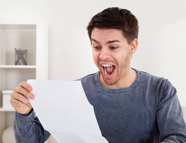 istock Exultant young man cheering good news 167230127