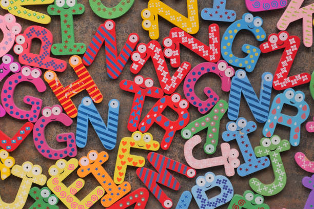 istock colorful plastic letters on white background, close up 1672302918