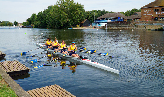 St Neots, Cambridgeshire, England -  July 23, 2022: Ladies coxless fours on the river Ouse Cambridgeshire.