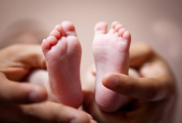 istock newborn baby feet 167231394