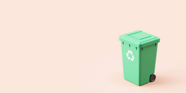 istock Green trash can with recycle sign on empty pink background 1672325102