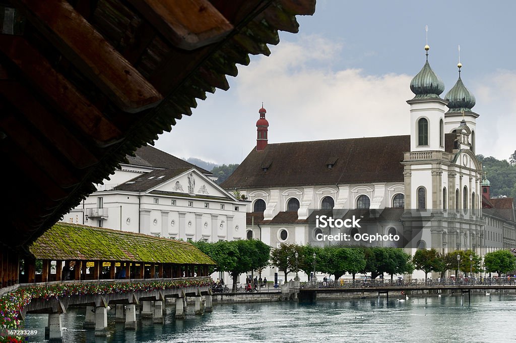 Exterior of the Jesuit Church in Lucerne, Switzerland Exterior of the Jesuit Church (Jesuitenkirche)in Lucerne, Switzerland.  Image taken from the Chapel Bridge.  This was the first large sacral Baroque building in Switzerland built in 1666 by Father Christoph Vogler. Antique Stock Photo