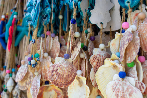 istock wall decorations and wind chimes made of evil eye beads and scallop shells. 1672334452