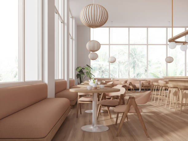 istock Stylish cafe interior with chairs and table in row, dining space with window 1672336487