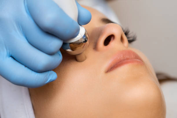 istock Close up expert applies hardware face massage for rejuvenation 1672340418
