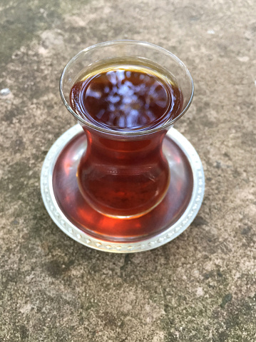 Turkish tea on the outdoor concrete table
