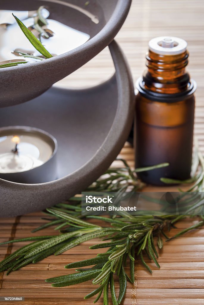 Rosemary Aromatherapy Close up of rosemary aromatherapy kit contains, rosemary essential oil (open vial), aromatic oil burner and fresh rosemary (Shallow depth of field) Alternative Medicine Stock Photo