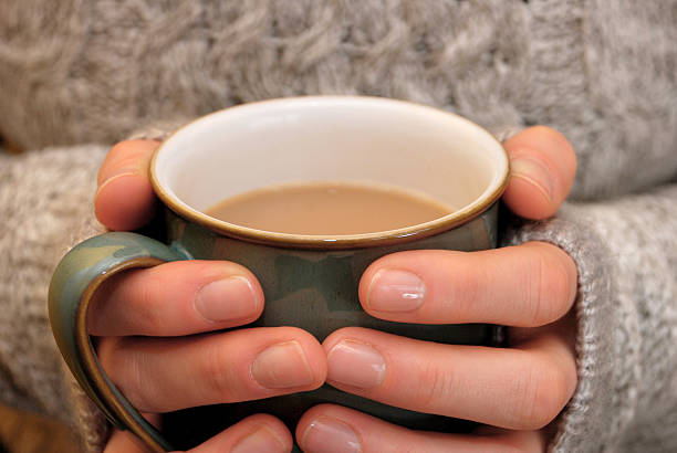 istock Two hands keeping warm, holding a hot drink 167235189