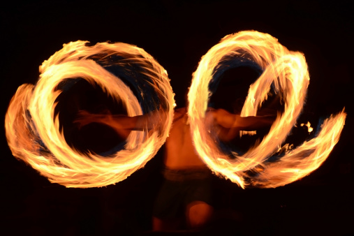 Traditional Samoan fire dancer practicing ancient ritual