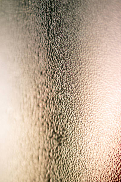 istock Water drops on glass, close-up background. 1672357061