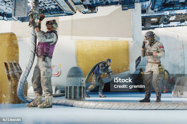 Futuristic Technicians Working On Space Rocket Engine Stock Photo - Download Image Now